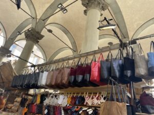 Visit markets in Florence to buy leather products